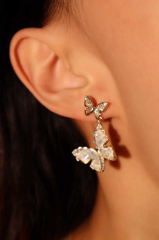 Aretes en forma de mariposa de cristal azul
