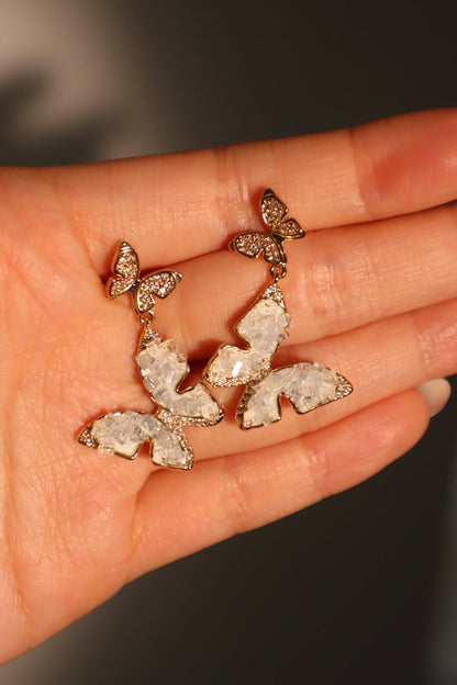 Aretes en forma de mariposa de cristal azul
