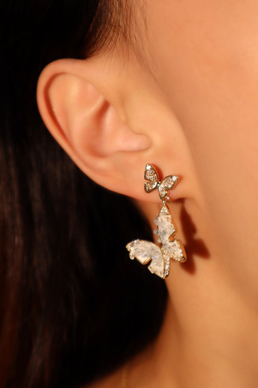 Aretes en forma de mariposa de cristal azul