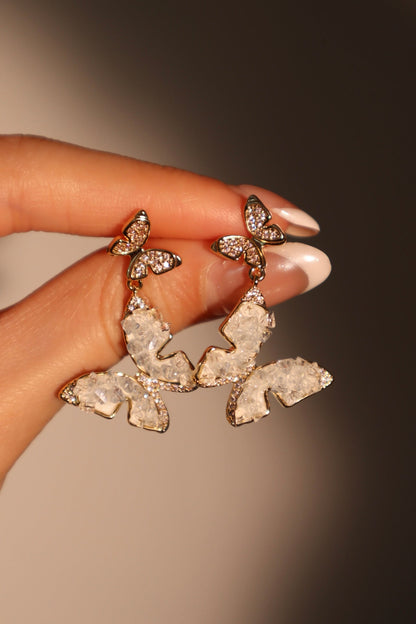 Aretes en forma de mariposa de cristal azul